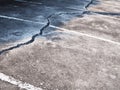 concrete floor or cement road on old parking lot damaged and cracked from ground subsidence Royalty Free Stock Photo