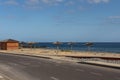 Road with old pedestrian crossing towards a golden manmade sand beach near the Atlantic, San Blas, Tenerife, Canary Islands Royalty Free Stock Photo