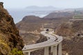 road over huge bridge bordering the mountains by the sea on the island of Gran Canaria. Spain, Europe Royalty Free Stock Photo