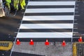 Road painter worker working on zebra crossing