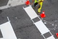 Road painter worker working on zebra crossing