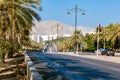 Road with palm trees. Traditional Omani architecture. Old Town of Muscat, Oman. Arabian Peninsula.