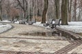 Road in the park with benches on a winter day Royalty Free Stock Photo