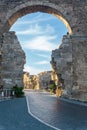 Road passes through the ancient Vespasian Gate in Side, Turkey Royalty Free Stock Photo