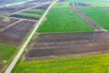 Road passing cultivated spring fields Royalty Free Stock Photo