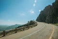 Road passing through rocky landscape in a sunny day Royalty Free Stock Photo