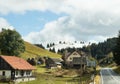 The road passing through the village at the foot of the CarpathiThe road passing through the village at the foot of the Carpathian