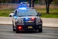 Road patrol police car on highway scene with emergency lights Royalty Free Stock Photo