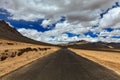 Road on plains in Himalayas with mountains Royalty Free Stock Photo