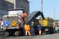 Road profiling: a pavement profiler Wirtgen working removing asphalt from a street road and loading it on a truck. Kyiv