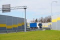 Exit from the motorway to a resting place. The area is surrounded by sound barriers