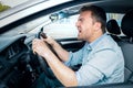 Road rage man at the wheel threatening other drivers Royalty Free Stock Photo