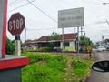 Jember, Indonesia, 10 May 2023. Waiting for the train to pass at the railroad crossing from inside the car Royalty Free Stock Photo