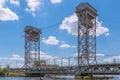 Road and railway two-level liftbridge on the Pregolya river on a sunny summer day. Created in 1914-1926. Until 1945, the bridge