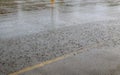 Road rain water drops background with blue sky reflection and circles on dark asphalt. forecast.