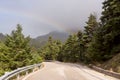 Road and rainbow in the mountains mountain Nafpaktia, western G Royalty Free Stock Photo