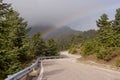 Road and rainbow in the mountains mountain Nafpaktia, western G Royalty Free Stock Photo