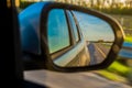 The road is reflected in the side mirror of the car Royalty Free Stock Photo