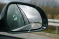 Road reflecting in wing mirror