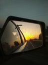 Road reflection in the car side mirror. Travel lifestyle vertical photo Royalty Free Stock Photo