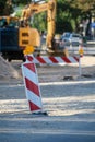 Road repair concept. road workers repair the road, fences in the foreground