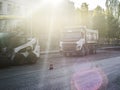 Road repair work. A team of working engineers, laying asphalt