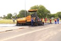 Road repairing with asphalt paving machine maun Royalty Free Stock Photo