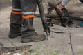 Road repairing works with jackhammer Royalty Free Stock Photo