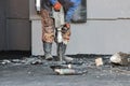 Road repairing works with jackhammer. Male worker using jackhammer pneumatic drill machinery on road repair. Arkhangelsk. Royalty Free Stock Photo