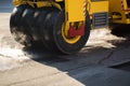 Road repairs. A road roller compacting asphalt. Royalty Free Stock Photo