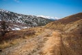 Road from a repeater on snowy tops of Altai mountains near Aktash town, Russia