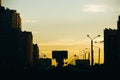 Road and residential buildings in city at sunset Royalty Free Stock Photo