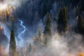 Road and river in autumn mountains