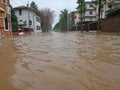 Road with the river mud overflown Royalty Free Stock Photo