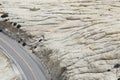 Road through rock formation in desert elevated view Royalty Free Stock Photo