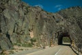 Road on rocky landscape passing through tunnel Royalty Free Stock Photo