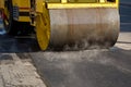 A road roller compacting asphalt. Royalty Free Stock Photo