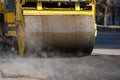 Road roller compacting asphalt during road repairs. Royalty Free Stock Photo