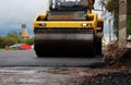 road roller compactor at work. asphalt pavement works for road repairing. expansion and repair of the roadway at the Royalty Free Stock Photo