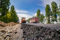 road roller flattening new asphalt.Heavy Vibration roller at work paving asphalt, road repairing Royalty Free Stock Photo