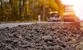 Road roller flattening new asphalt. Heavy vibration roller at work paving asphalt, road repairing Royalty Free Stock Photo