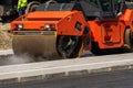 Road roller machine working on asphalt road maintenance project Royalty Free Stock Photo