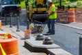 Road roller machine works on the fresh asphalt