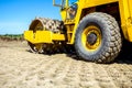 Road roller with spikes is working at construction site Royalty Free Stock Photo