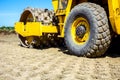 Road roller with spikes is working at construction site Royalty Free Stock Photo