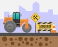 Road roller on the road and warning sign under construction on the city background