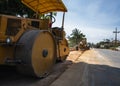 Road rollers working on the new roads construction site. Heavy duty machinery working on highway. Construction equipment