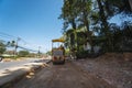 Road rollers working on the new roads construction site. Heavy duty machinery working on highway. Construction equipment