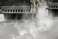 Road rolling machines working with steam on the asphalt Royalty Free Stock Photo