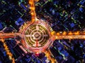 Road roundabout with car lots Wongwian Yai in Bangkok,Thailand.street large beautiful downtown at night.Aerial view cityscape.